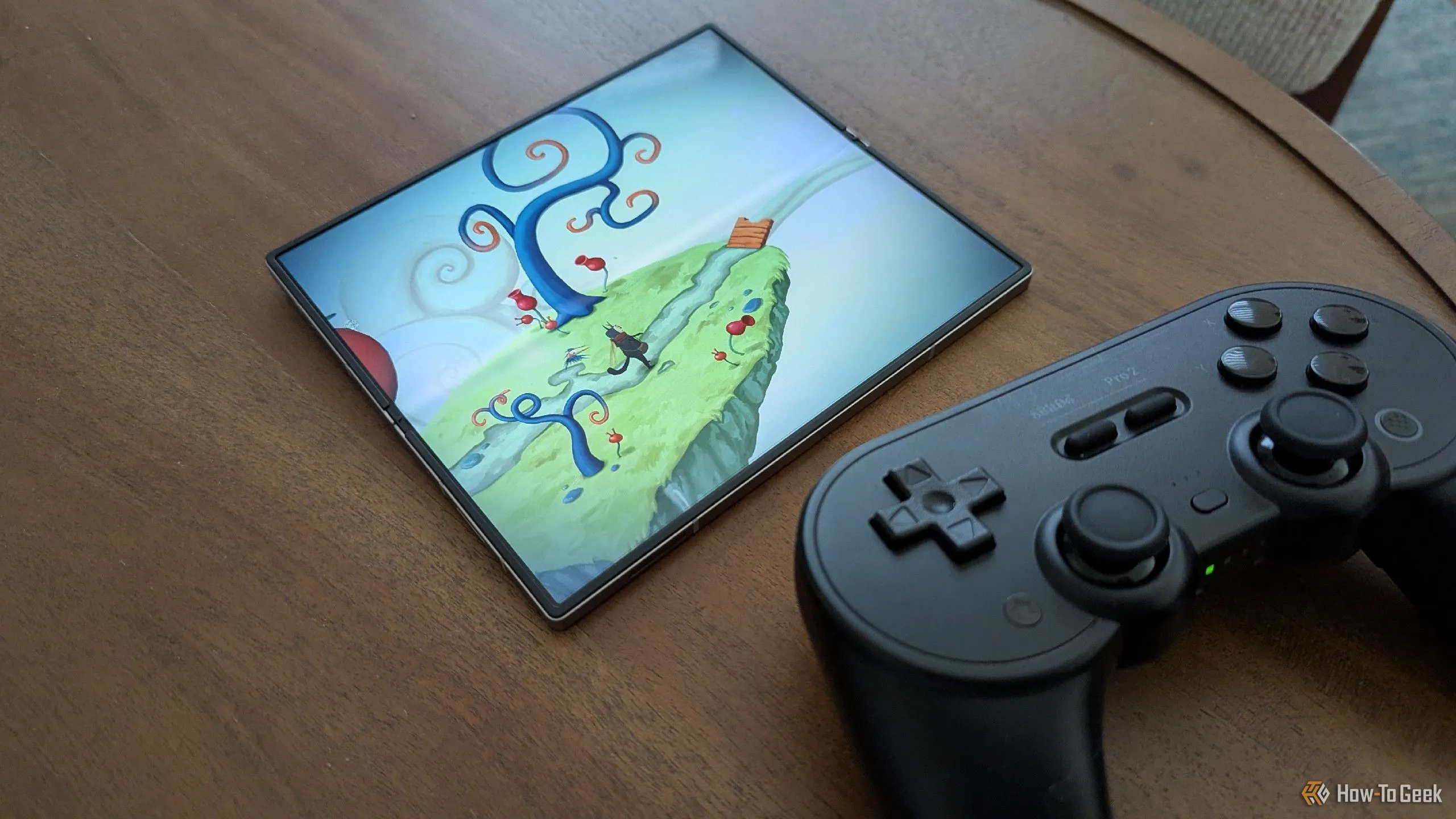 Game Figment trên Samsung Galaxy Z Fold 6 cùng bộ điều khiển 8BitDo Pro 2, minh họa sự tiện lợi và trải nghiệm tối ưu khi chơi các tựa game PC được port lên di động.