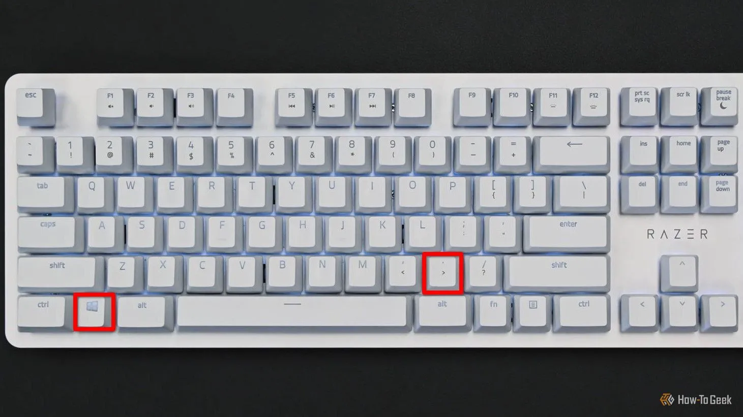 Bàn phím với phím Meta và dấu chấm được làm nổi bật để mở bảng chọn emoji