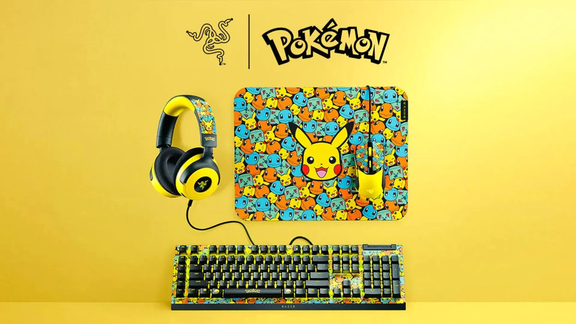 Bộ phụ kiện gaming Razer chủ đề Pokémon gồm bàn phím, chuột và bàn di chuột với màu sắc vàng nổi bật.