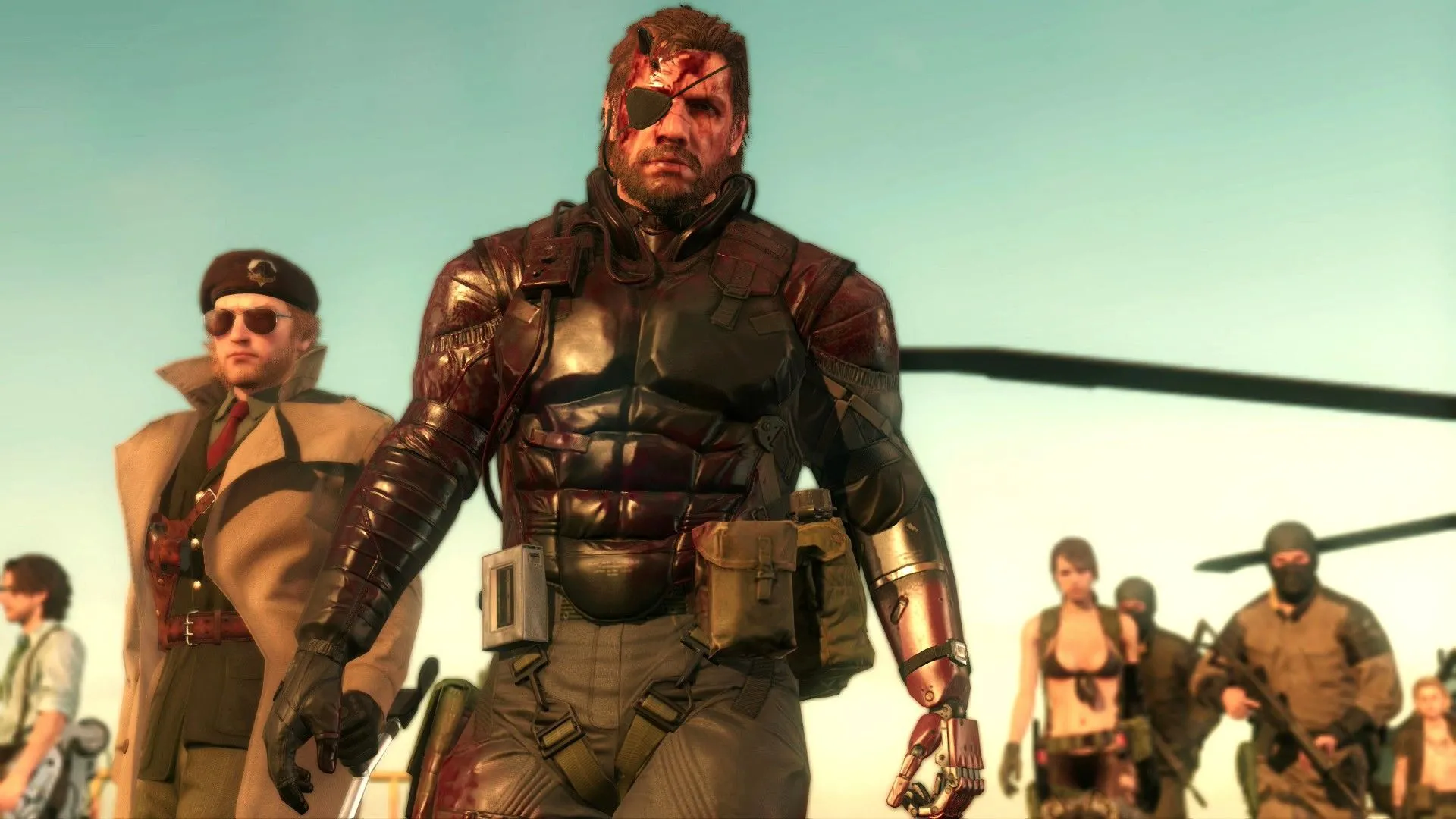 Các nhân vật chính của Metal Gear Solid V: The Phantom Pain như Huey Emmerich, Kazuhira Miller, Venom Snake và Quiet cùng đồng đội đang nhìn vào màn hình điều khiển, minh họa cho sự rạn nứt giữa Hideo Kojima và Konami.