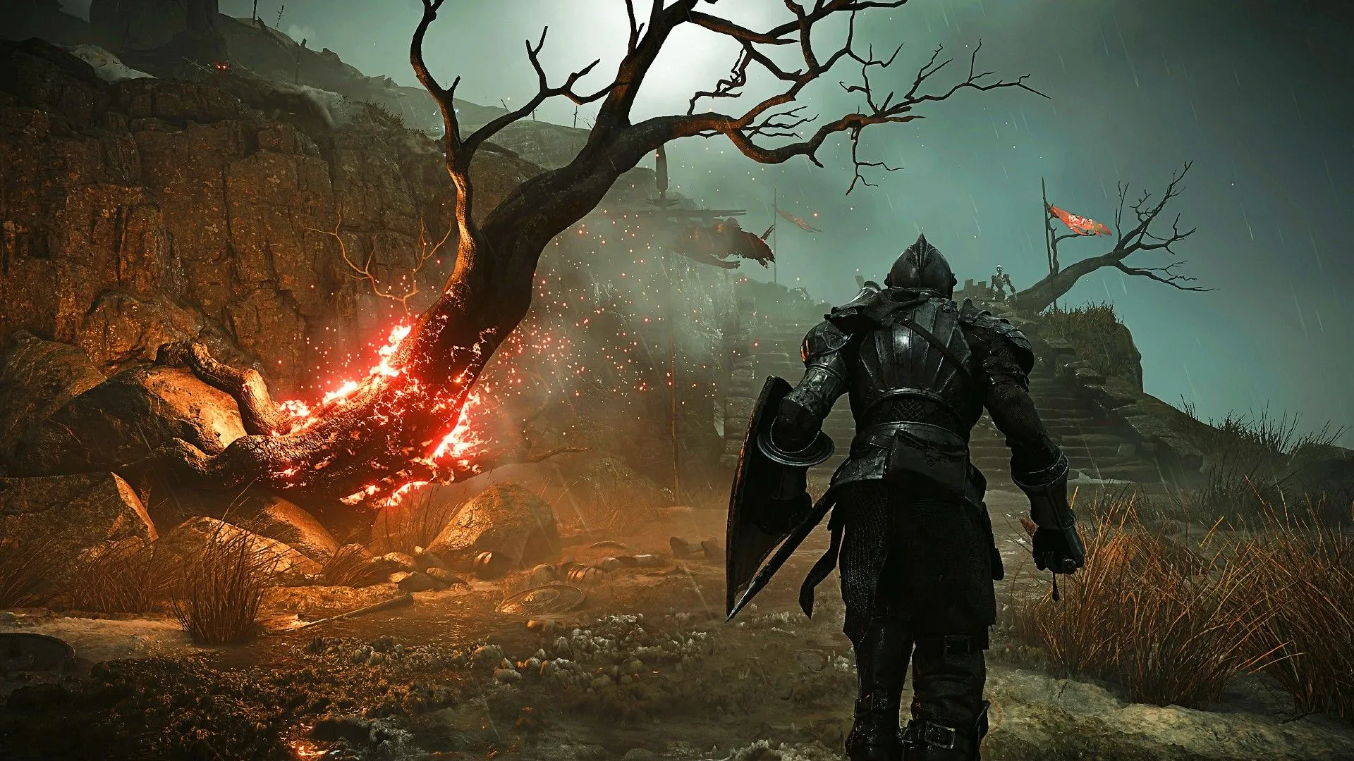Cảnh đền thờ bão trong Demon's Souls, một người chơi đang đi ngang qua cây cháy.