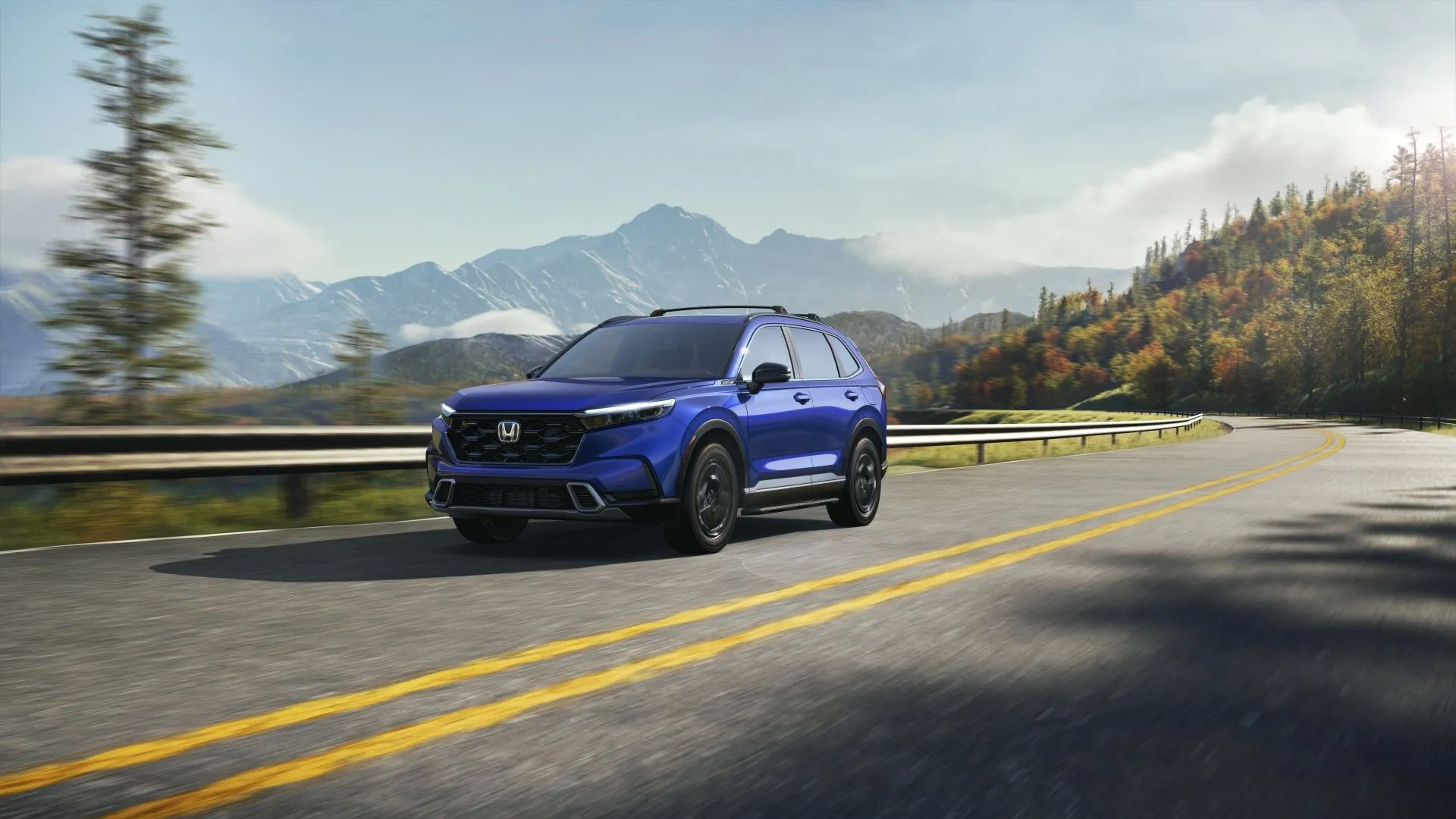 Honda CR-V Sport Touring 2023 màu xanh đậm đang di chuyển năng động.