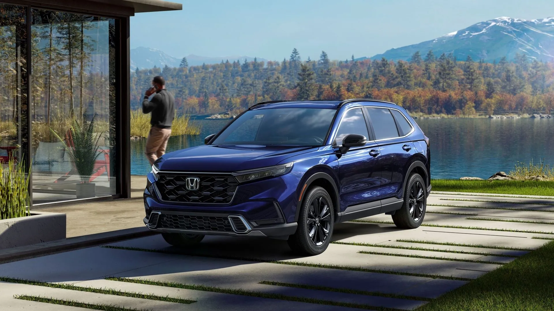 Honda CR-V Sport Touring 2025 màu xanh đậm, góc 3/4 phía trước, trên nền cảnh đô thị