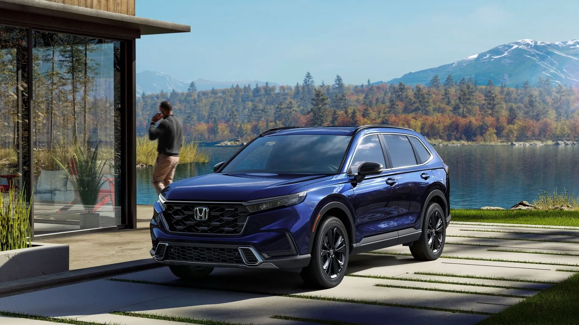 Honda CR-V Sport Touring Hybrid 2023 màu xanh đậm, góc 3/4 phía trước, đỗ bên bờ hồ, mang lại sự tiện nghi và khả năng vận hành linh hoạt.