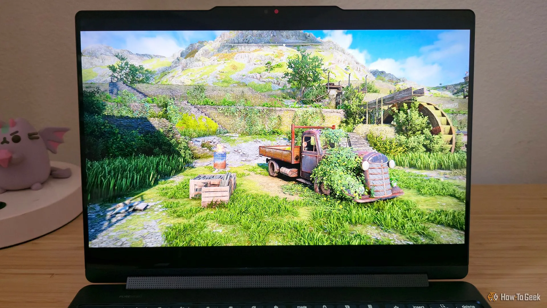 Laptop Lenovo Yoga 9i 2-in-1 Gen 10 Aura Edition đang chơi game Atomfall.