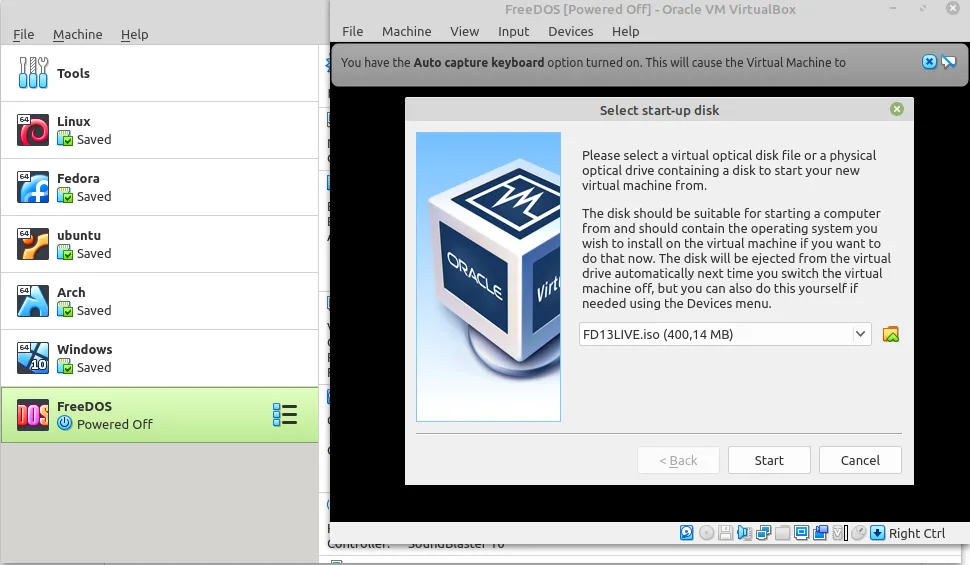 Lựa chọn tệp ảnh CD FreeDOS (ISO) để khởi động máy ảo trong VirtualBox