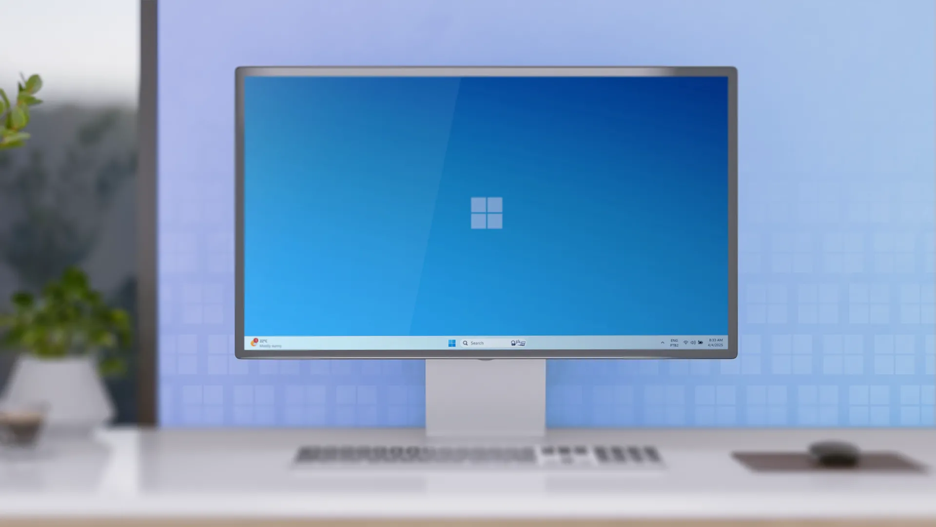 Một bàn làm việc tối giản với máy tính để bàn chạy Windows 11, tượng trưng cho hệ thống máy tính truyền thống mà nhiều người vẫn phụ thuộc.