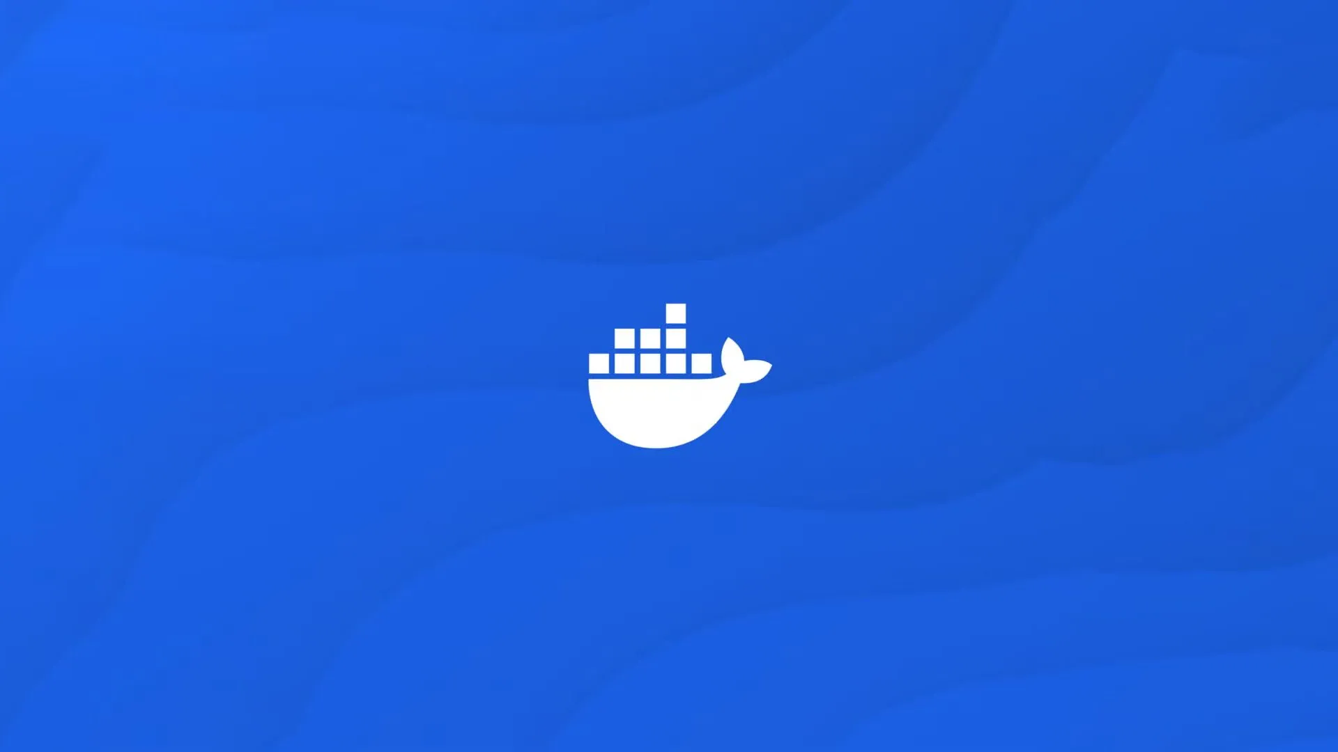 Logo Docker màu trắng trên nền xanh, biểu trưng cho sự đơn giản và hiệu quả của nền tảng container
